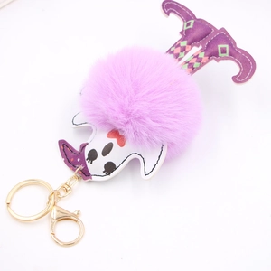 Halloween ghost keychain with purple pom pom, green checkered legs and golden metal clip