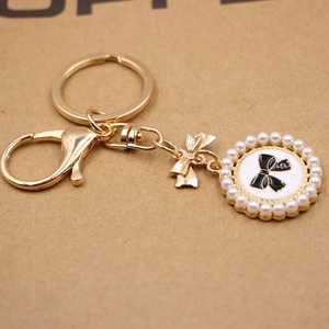 Elegant Alloy Bowknot Faux Artificial Pearl Keychain Round Pendant Gold Lobster Clasp Bag Charm Accessory For Women Girls