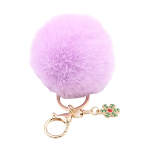 Porte-clés pompon en fausse fourrure violet clair avec pendentif flocon de neige vert