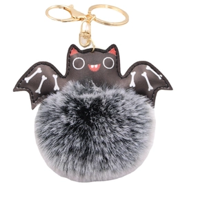 Halloween bat keychain with faux fur ball and gold metal clasp on white background