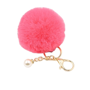 Pink faux fur pompom keychain with golden metal clasp and decorative pearl pendant
