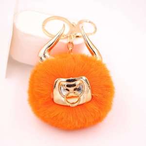 Orange faux fur bull keychain with golden horns and nose ring for car keys or bags