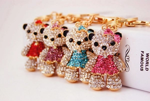 Detailed view of four colorful crystal bear keychains with sparkling rhinestones for bags