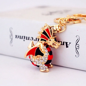 Porte-clés dragon créatif doré avec émail rouge et pendentif en strass étincelants