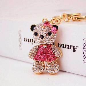 Sparkly crystal teddy bear keychain with pink rhinestones on a golden alloy ring