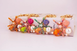 Détails des porte-clés étoile de mer et coquillage avec strass colorés et perles nacrées