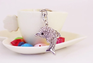 Macro view of crystal dolphin keychain with sparkling rhinestones and lobster clasp detail