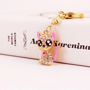 Golden cat keychain with rhinestones and pink enamel details for women bags