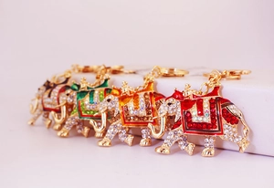 Detail view of colorful elephant keychains with sparkling rhinestones and gold plating