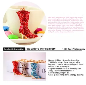 Detail showing colorful rhinestone tall boot keychains in red, blue and champagne