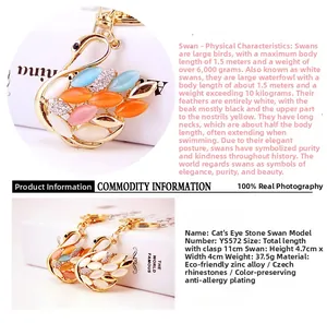 Macro shot of colorful opal stones and crystals set on a swan-shaped keychain