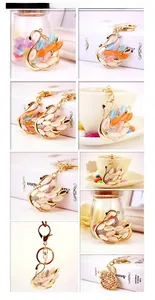 Detail view of gold swan keychains with colorful opal stones and rhinestone accents