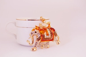 Detailed close-up of a sparkling rhinestone elephant keychain with gold-tone plating