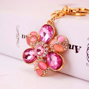 Creative crystal flower keychain with cat eye stone and diamonds on gold-plated alloy