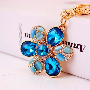 Creative blue crystal flower keychain with cat eye stone and gold alloy base