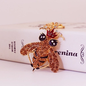 Simpatico portachiavi a forma di ape dorata con strass ambra e corona rossa chic