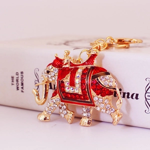 Sparkling colorful elephant keychain with red rhinestones and golden enamel plating