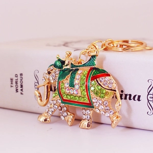 Sparkling crystal elephant keychain with colorful rhinestones and green enamel inlay