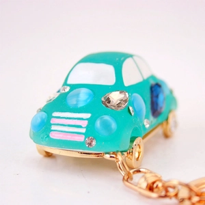 Porte-clés voiture mignon en pierres précieuses sarcelle avec strass et chaîne dorée