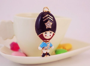 Detail of creative Royal Guard keychain with sparkling rhinestones and enamel finish