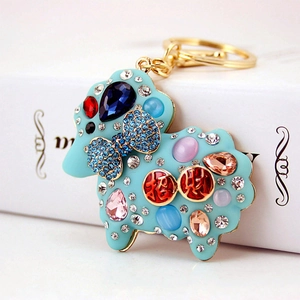 Sky blue sheep keychain with colorful rhinestones and gold Zhaocai fortune lettering