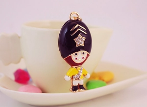 Close-up of cute royal guard keychain with sparkling rhinestones and enamel finish