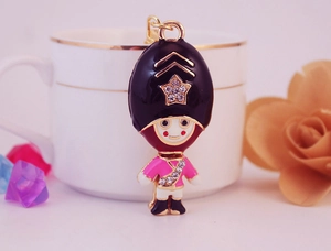 Detailed close-up of Royal Guard keychain featuring colorful enamel and white rhinestones
