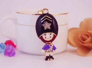 Detailed close-up of a royal guard keychain with enamel finish and sparkling rhinestones
