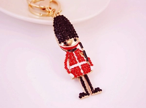 Detail of creative British Royal Guard keychain with sparkling red and black rhinestones