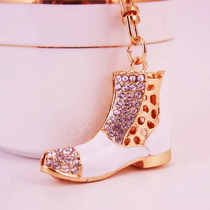 Fashionable sparkling crystal rhinestones and white enamel boot keychain with gold-plated finish