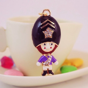 Creative Royal Guard keychain with rhinestones and enamel finish on a gold metal ring
