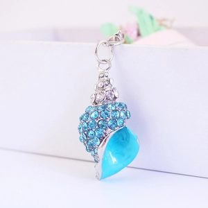 Sparkling shell keychain with blue rhinestones and silver metal finish on gift box