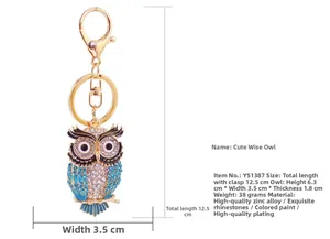 Vue détaillée du porte-clés hibou en strass bleus brillants avec dimensions précises.