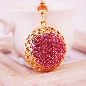 Porte-clés doré évidé avec cristaux roses et motifs géométriques créatifs et brillants