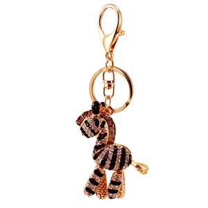 Portachiavi zebra scintillante con strass bianchi e neri su metallo dorato per borsa