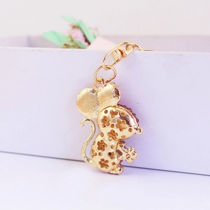 Cute gold mouse keychain with floral hollow design and pink crystals for handbags