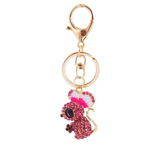 Cute gold mouse keychain with pink crystals and lobster clasp on white background