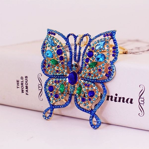 Exquisite butterfly keychain with blue and emerald rhinestones on golden ring