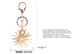 Detailed view of baroque sun keychain with size markings and pearl centerpiece.