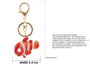 Detail showing clownfish keychain size 4.6x5.4x1.5cm with sparkling white rhinestones
