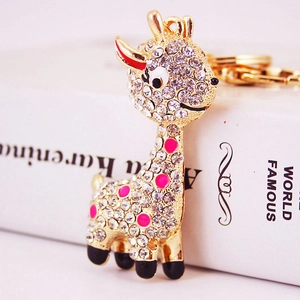 Sparkling rhinestone giraffe keychain with gold alloy finish and colorful enamel accents