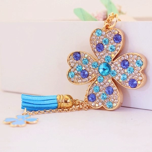 Porte-clés trèfle à quatre feuilles créatif avec strass bleus et pendentif gland bleu clair