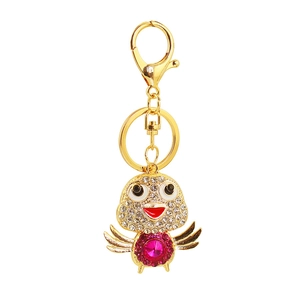 Detailed view of crystal chick keychain with rhinestone wings and rose red gemstone
