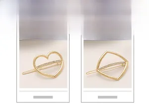 Detailed view of matte gold hair clips with heart and geometric shapes with rhinestones