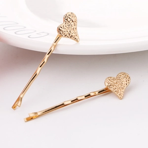 Minimalist gold heart hair clips with textured matte finish for women hair styling