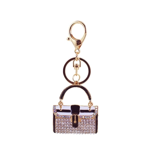 Exquisiter vergoldeter Handtaschen-Schlüsselanhänger mit schwarzem Emaille und Strass