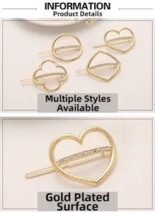 Detail of gold-plated hair clips with rhinestone heart and clover shapes set on beige background