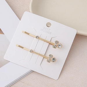 Elegant gold alloy hair clips with crystal Mickey Mouse shape on a jewelry card