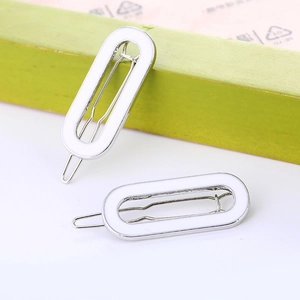Pair of minimalist white oval metal hair clips for women in a modern Korean style