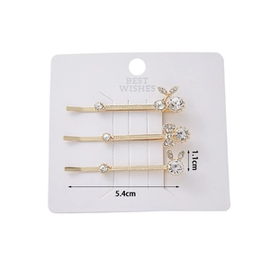 Three-piece rhinestone hair clip set with cherry, bow, and rabbit designs on gold alloy